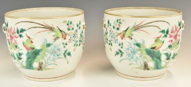 A pair of Chinese 19th / 20thC famille verte twin-handled jardinières with bird decoration, height