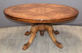 19thC inlaid walnut oval tilt top table raised on a carved base, W103 x D73 x H48cm