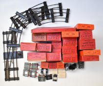 A collection of Hornby 0 gauge model railway track and accessories including buffer stops, curved