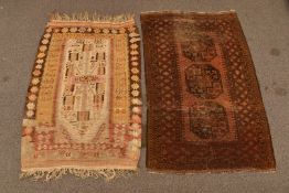 A hanging wool rug, probably Caucases, 170 x 106cm, together with a Turkoman rug with three guls,