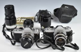 Two Nikon Nikkormat 35mm SLR cameras comprising FT with 35mm 1:2.8 lens and FT2 with 50mm 1:2, 200mm