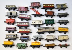 Twenty nine Hornby 0 gauge model railway wagons, vans, coaches and trucks including Saxa Salt, Shell