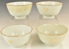 Four Chinese Kangxi period pedestal bowls with ivory / celadon glaze, from the Vung Tau Cargo,