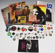 A collection of mostly music-related pin badges plus three copies of The Face, tour programmes,