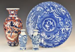 Japanese blue and white charger, an Imari vase and two Chinese vases, tallest 32cm