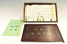 A bone and bamboo Mah Jong set, in wooden box with instructions
