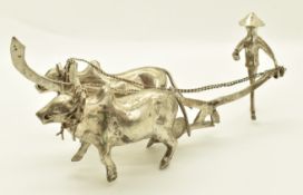 Chinese or similar silver or novelty model of a man with two oxen and plough, length 15cm, weight