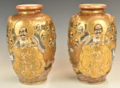 Pair of Japanese vases with figural decoration, height 23cm