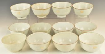 Twelve Chinese Kangxi period pedestal bowls with ivory / celadon glaze, from the Vung Tau Cargo,