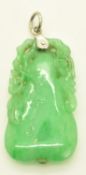 A carved jadeite pendant in the form of a pear and foliage, 7.3g, 3.5 x 1.8cm