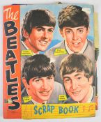 Beatles NEMS scrapbook with colour magazine poster pages and black and white clippings, contents