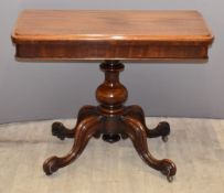 Victorian mahogany fold over card table raised on bulbous base and four scrolling legs, W90 x D45