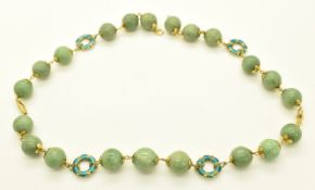 A 14k gold necklace made up of jadeite and circular enamel links, from Doha, 82.2g