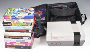 Nintendo Entertainment System NES with two controllers, Game Genie and 10 boxed games including