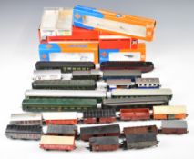 Twenty four Roco, Jouef and similar 00 gauge model railway continental goods wagons and coaches,