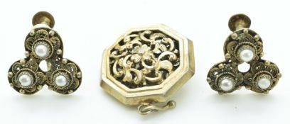 A pair of Chinese silver filigree earrings set with faux pearls and a silver gilt Chinese pendant