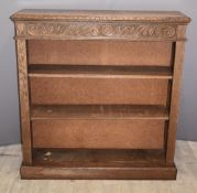 Oak bookcase with carved decoration, W109 x D33 x H114cm