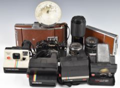 Collectable cameras to include Canon A-1 35mm SLR with 50mm 1:1.4 lens, Polaroid SX-70, Polaroid 95A