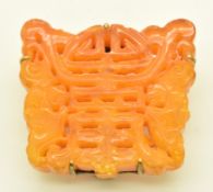 Chinese silver gilt clip set with carved amber in the form of a Chinese character, 3.5cm, 15.2g