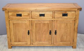 Contemporary solid oak sideboard with three drawers and cupboards, W139 x D42 x H83cm