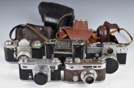 Five 35mm SLR and rangefinder cameras including Kiev 4 with 2/50 lens, Edixa flex with 1:2.8 50mm