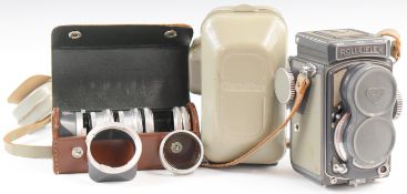 Rolleiflex Baby TLR camera with 1:3.5 60mm lens, in original hard case together with a lens hood and