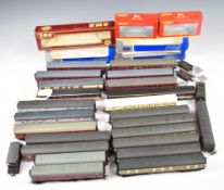 Twenty six Hornby, Dapol and similar 00 gauge model railway coaches, wagons and vans, some in