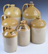 Six stoneware flagons including Shergold & Kimber, Gilletts Cirencester, Bateman Stroud, Mason's