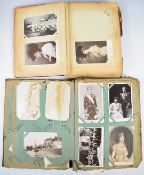 Approximately 280 postcards contained in two Edwardian postcard albums including military cards,