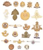 Twenty three Army lapel pin brooches / badges including 9th Lancers, Worcestershire Regiment,