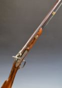 English 12 bore percussion hammer action muzzle loading shotgun with engraved locks, chequered