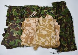 Modern combat clothing comprising field jacket, four DPM jackets with three DPM trousers, three