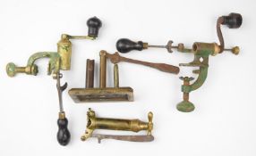 Four various brass and metal shotgun cartridge re-loading tools comprising two .410 rollover tools