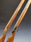 A pair of decorative flintlock guns with 28.75 inch barrels, overall length 109cm.