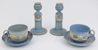 Wedgwood Jasperware tricolour cup and saucer, pair of candlesticks and similar cup and saucer with
