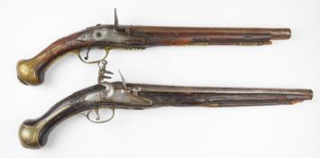 Two Turkish flintlock holster pistols each with carved grip, metal inlaid decoration, wrist