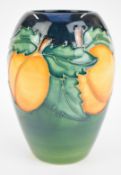 Moorcroft vase decorated with apricots, height 14cm