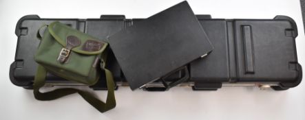 A collection of gun cases and accessories comprising a double shotgun or rifle wheeled flight case