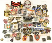 Large collection of cloth badges and rank insignia including American, Russian, British, silk