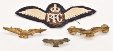 Three Royal Air Force / Pathfinder metal badges together with a pair of cloth RFC wings