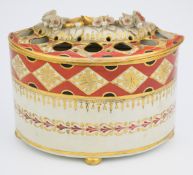 Chamberlains Worcester bough pot and cover with applied flower decoration, raised on three ball