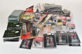 A collection of gun and shooting parts and accessories including air rifle springs, choke pouches,