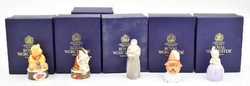Five Royal Worcester candle snuffers including two limited edition examples Unicorn and Toby, all