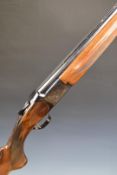 Miroku 12 bore over and under ejector shotgun with engraved locks, chequered semi-pistol grip and