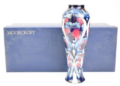 Moorcroft vase decorated in the Hepatica pattern and signed Emma Bossons, height 27.5cm