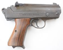 FB Record Jumbo .177 air pistol with shaped wooden grips and adjustable sights, serial number