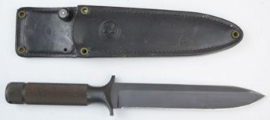 Chris Reeve survival knife of one piece steel construction, with 19cm blade and leather sheath