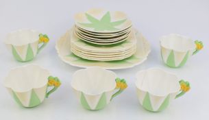 Eighteen pieces of Shelley Art Deco tea ware decorated in the Apple Green Star pattern no 119939,