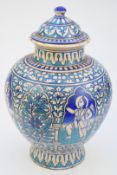 Indian 19thC Sind pottery pedestal covered vase with figural decoration, height 39cm