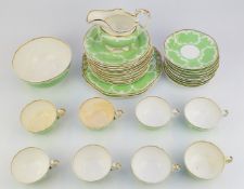 Thirty four pieces of 19thC Copeland tea ware decorated with relief moulded garlands against a green